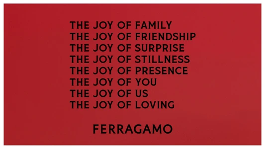 Bold red background featuring centered black uppercase typographic text with the brand name Ferragamo at the bottom