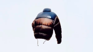 The North Face Summit Nuptse down jacket floating against a plain white background