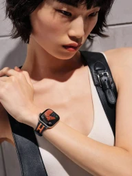 Model Wenli Zhao wearing an Hermes Apple Watch and white tank top against a neutral background for the 2026 project.