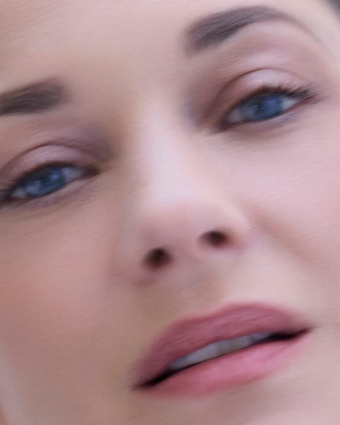 Close-up beauty portrait of Marion Cotillard focusing on her eyes and face