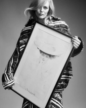 Vanessa Paradis in a tweed jacket holding a framed vintage portrait for Pop Magazine