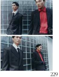 Two male models posing in tailored suits against a glass block wall for French Magazine Future Perfect editorial.