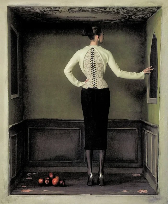 Gigi Hadid photographed from behind inside a shadowy box-like architectural enclosure with a small pile of apples on the floor.