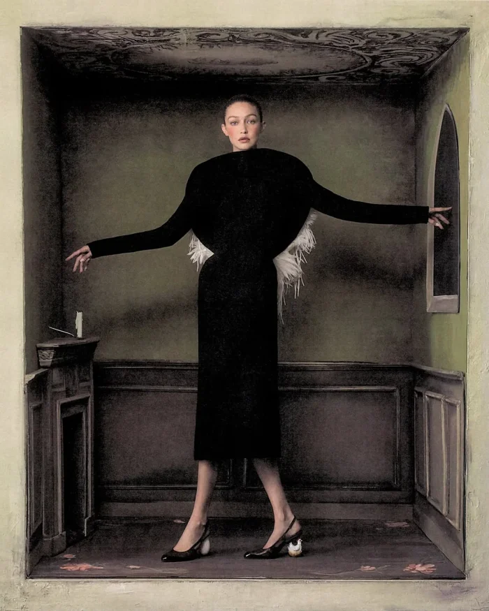 Gigi Hadid wearing a sculptural black dress standing inside a trompe l'oeil painted room for WSJ editorial.