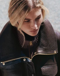 Grace Elizabeth wearing a brown textured leather jacket and ribbed turtleneck for Veronica Beard Fall 2026