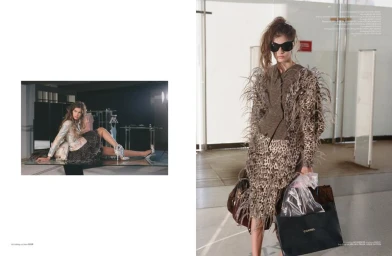 Model in leopard print feathered dress with sunglasses and shopping bags