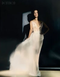 Kerry Washington wearing a flowing white gown in a moody editorial portrait captured by Rachell Smith for DEFINED Magazine