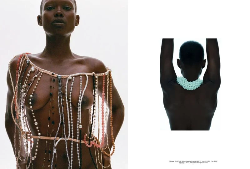 Model wearing draped pearl necklaces against a white background for the Clear Lines project by magazinemagazine