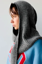 Model in grey knitted hooded scarf wearing blue sweatshirt against a neutral background for Pull&Bear A/W 2026