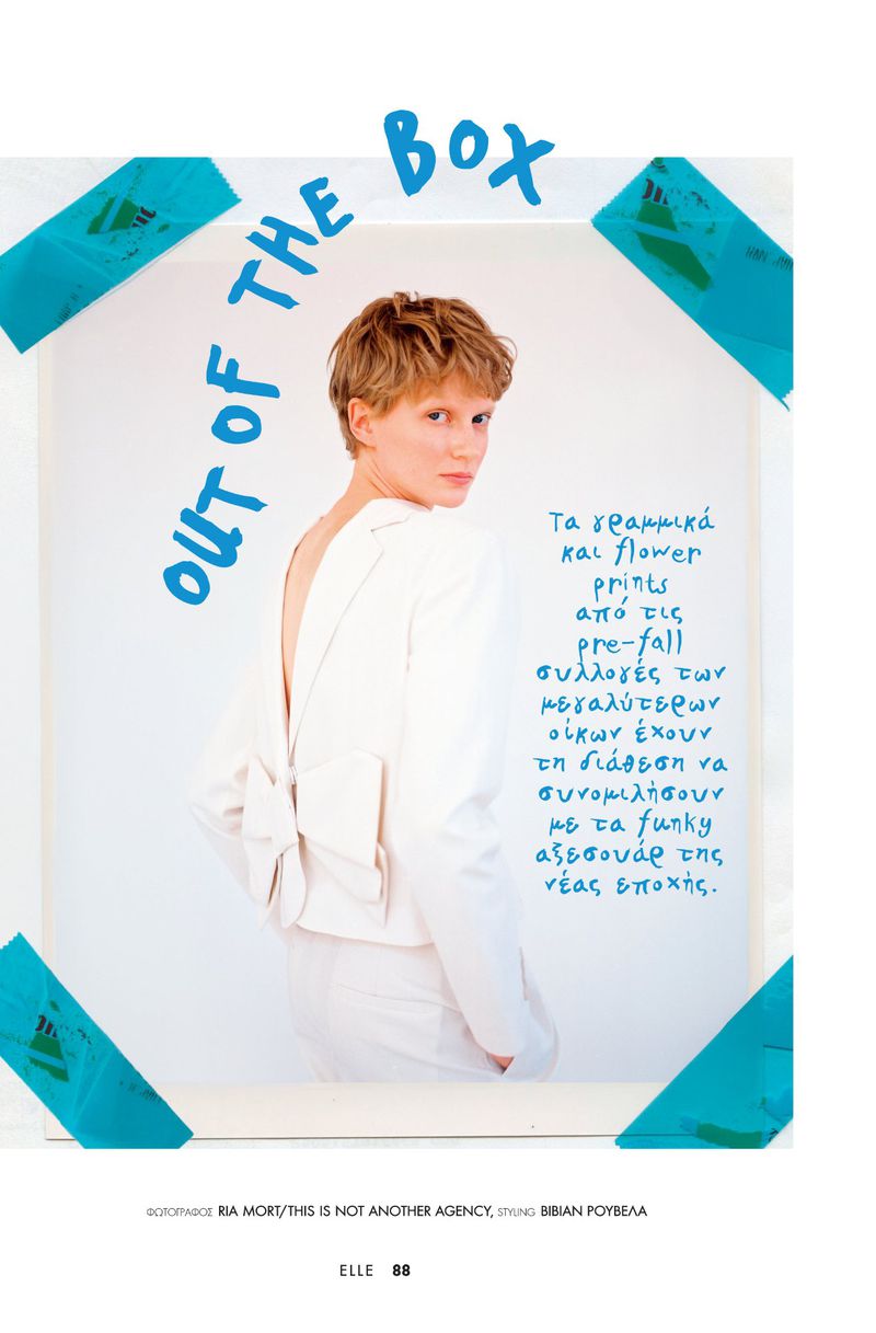 A young adult female poses indoors wearing a white suit against a white backdrop with text and graphic elements for a magazine editorial.