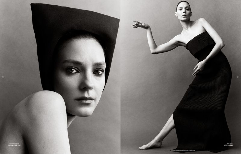 Model Kati Nescher in a black strapless dress and sculptural hat against a grey seamless background