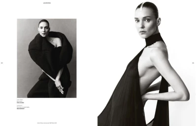 Monochrome fashion spread featuring model Kati Nescher wearing sculptural dark garments against a plain white background.