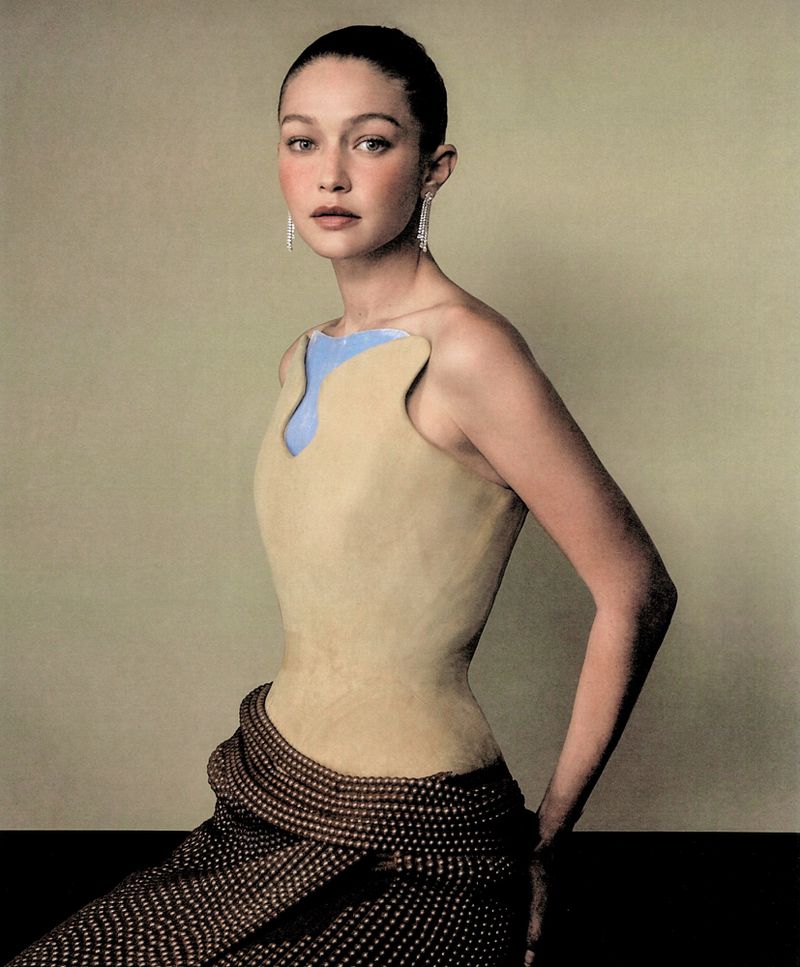Gigi Hadid in a structured beige top and polka dot skirt for WSJ editorial