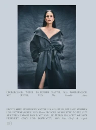 Model wearing a loose dark grey belted wool coat against a dark textured backdrop for Harper's Bazaar Germany editorial