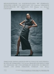 Model Alla Kostromichova posing in a grey midi dress against a textured dark backdrop for Harper's Bazaar Germany
