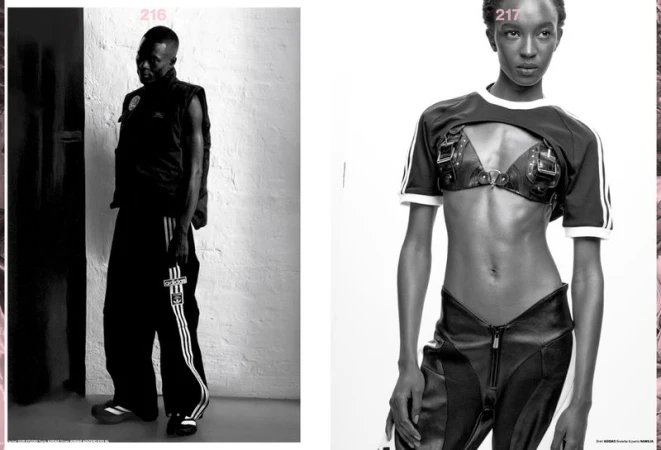 Two fashion models pose indoors. An African-American adult male models Adidas track pants, while an African female model poses in a leather bra.