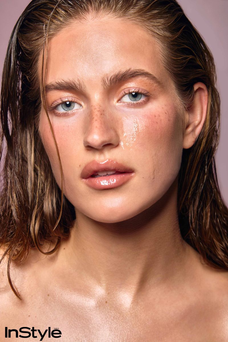 Close-up beauty portrait of a woman with wet hair and dewy glowing skin for InStyle Greece skincare editorial by Evangelos Rodoulis.