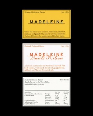 Three product packaging label designs for Madeleine butter featuring typography against a black background