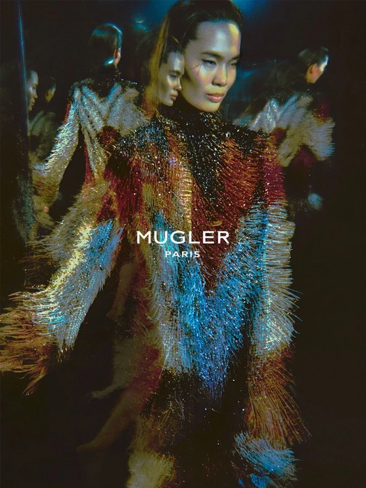 Model in shimmering fringed dress captured with multiple exposure effect, photographed by Elizaveta Porodina for Mugler.