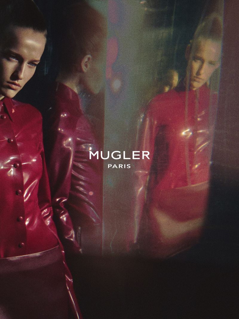 Model in shiny red button-down top reflected in multiple mirrors for Mugler Naturalia X Spring Summer 2027 campaign