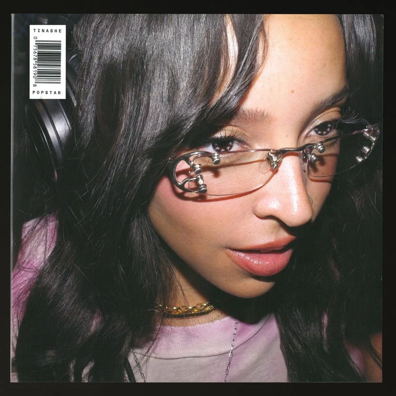 Tinashe wearing frameless metal glasses and headphones for an album cover portrait by Hugo Comte.