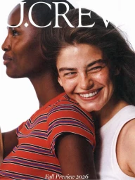 Two smiling female models posing together against a bright white background for J. Crew photographed by Dudi Hasson.
