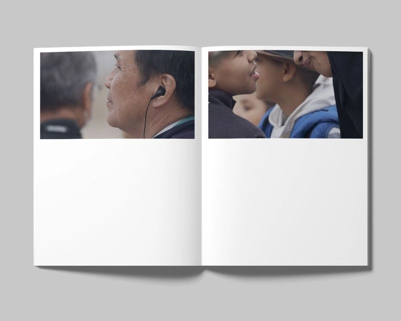 Open magazine spread displaying two horizontal photo stills featuring people in profile against an out-of-focus background.