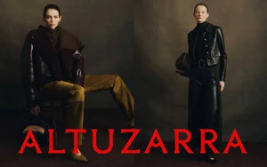 Two models showcasing Altuzarra Fall 2026 fashion against a muted dark background with red brand typography
