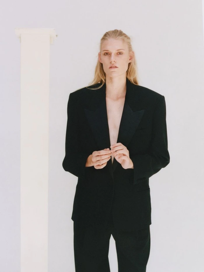 Model Bodine Van Galen wearing a black blazer and trousers for D Repubblica photographed by Alice Neale.