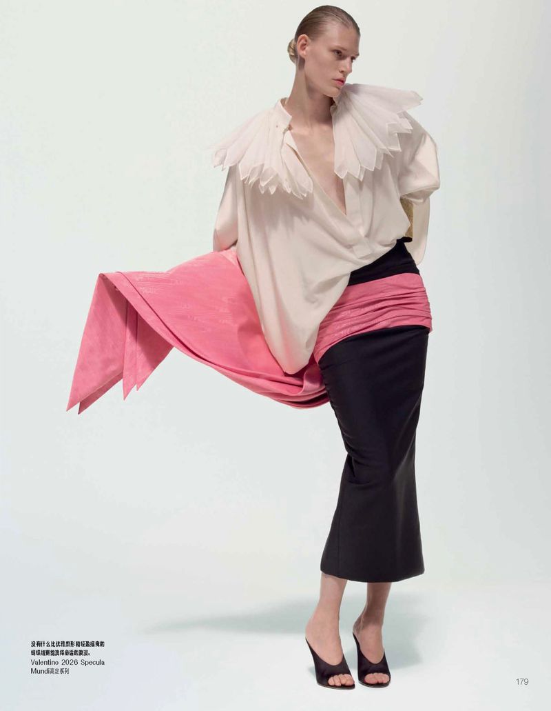 Model Bodine Van Galen in white ruffled collar blouse and black skirt for Vogue China Once Upon A Time project