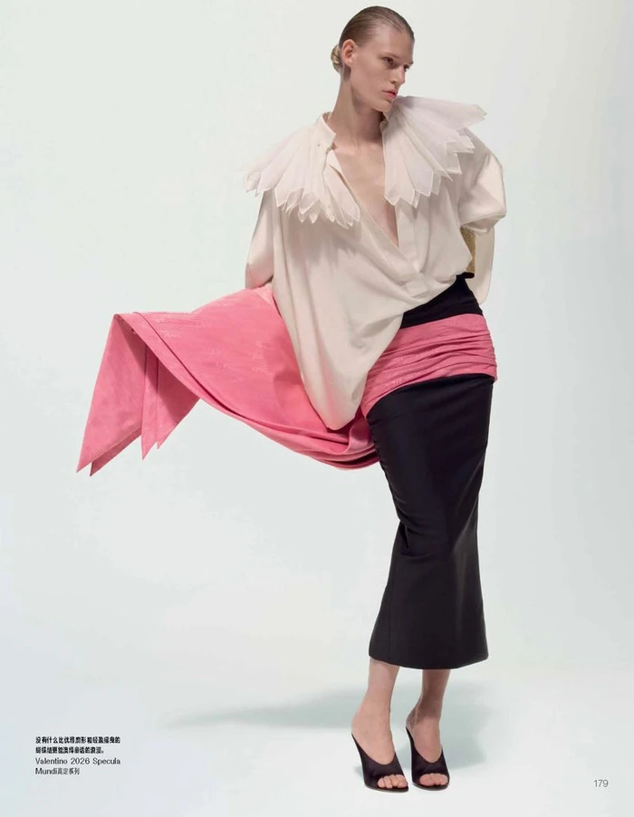 Model Bodine Van Galen in white ruffled collar blouse and black skirt for Vogue China Once Upon A Time project