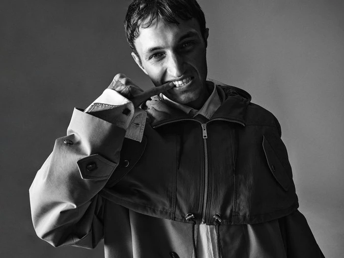 Anwar Hadid wearing a hooded jacket against a seamless grey studio backdrop for Archives Futures.