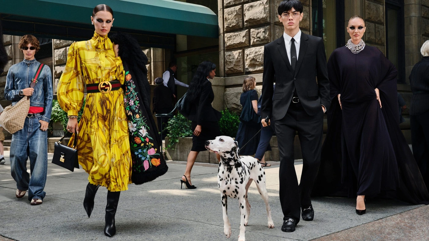 Models in Gucci fall campaign walking on a New York City sidewalk with a dalmatian dog.