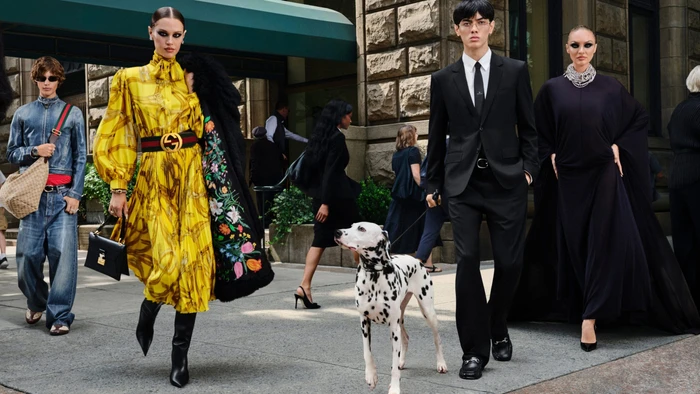 Models in Gucci fall campaign walking on a New York City sidewalk with a dalmatian dog.