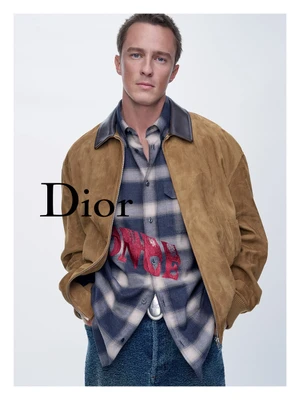 Drew Starkey in a camel suede jacket and plaid shirt for Dior Cruise 2027 campaign photographed by Sam Rock
