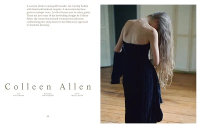 Woman with long blonde hair seen from behind wearing a strapless dark dress indoors with wooden floors