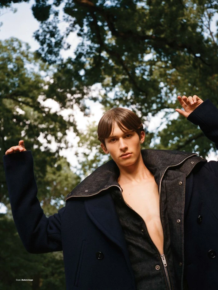 Model Josiah Turner posing outdoors under tree canopy for Men's Folio Singapore Park life fashion editorial