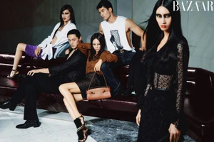 Group of models posing in stylish apparel on a dark leather sofa for a Harper's Bazaar China editorial project.