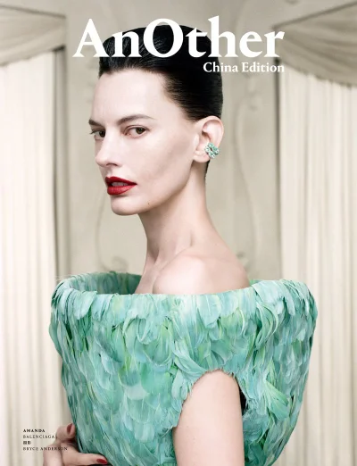 Model Amanda Murphy in a textured mint green feather top with slicked-back hair and bold red lips for AnOther China Edition magazine.