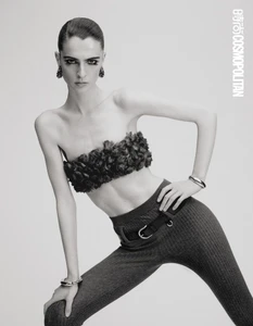 Model in strapless textured top and fitted trousers posing against a white background for Cosmopolitan China