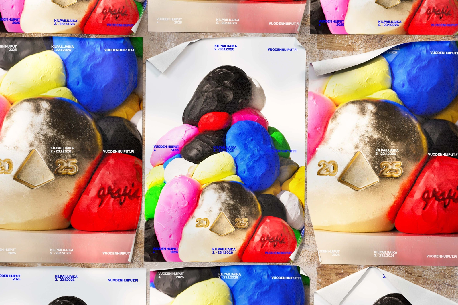 Multiple posters featuring colourful textured clay forms and the numbers 20 and 25 arranged in a grid pattern.