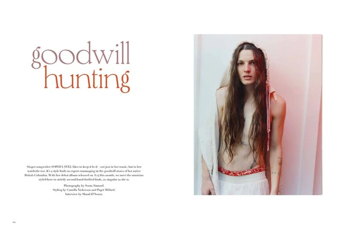 Editorial portrait of a woman with long brown hair wearing a white hooded garment and skirt for More or Less Magazine.
