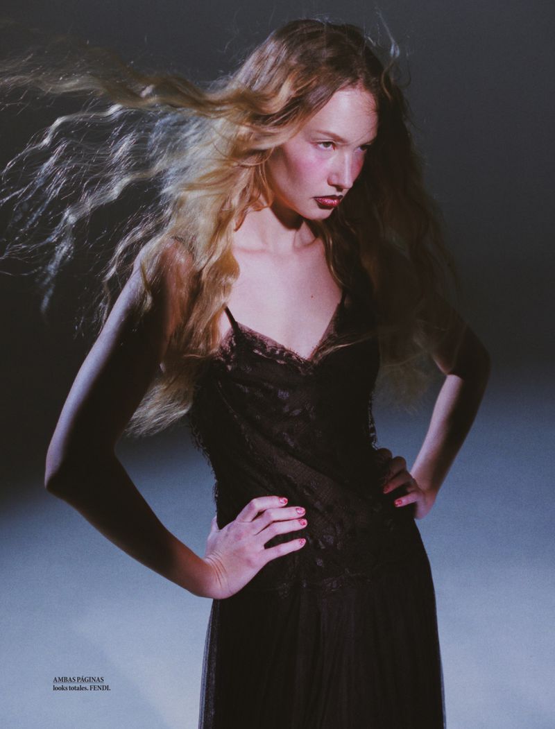 Model Katya Plotnikova with flowing blonde hair wearing a dark lace dress in an editorial portrait for Elle Mexico.