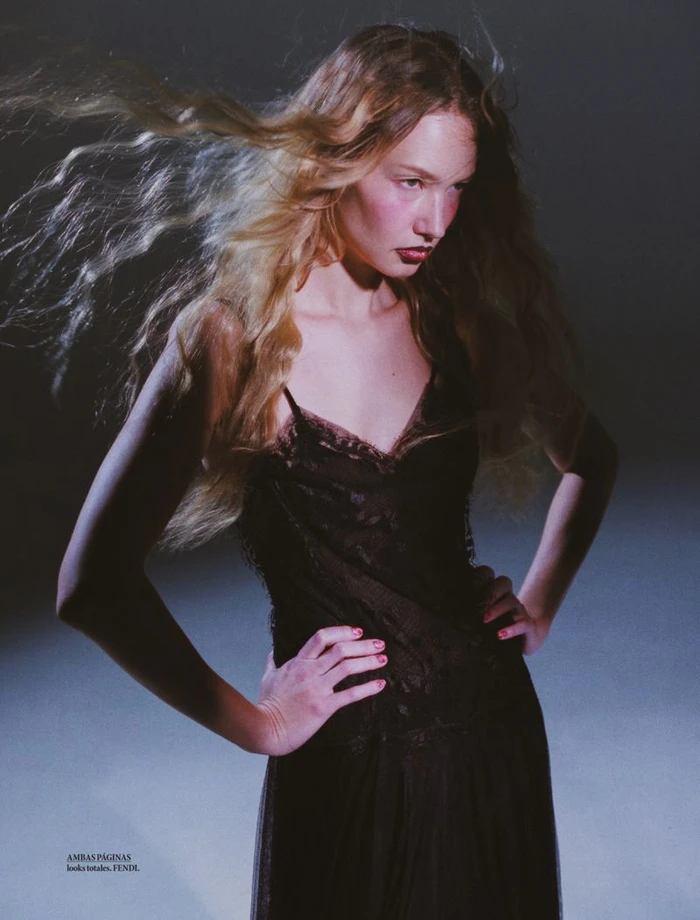 Model Katya Plotnikova with flowing blonde hair wearing a dark lace dress in an editorial portrait for Elle Mexico.