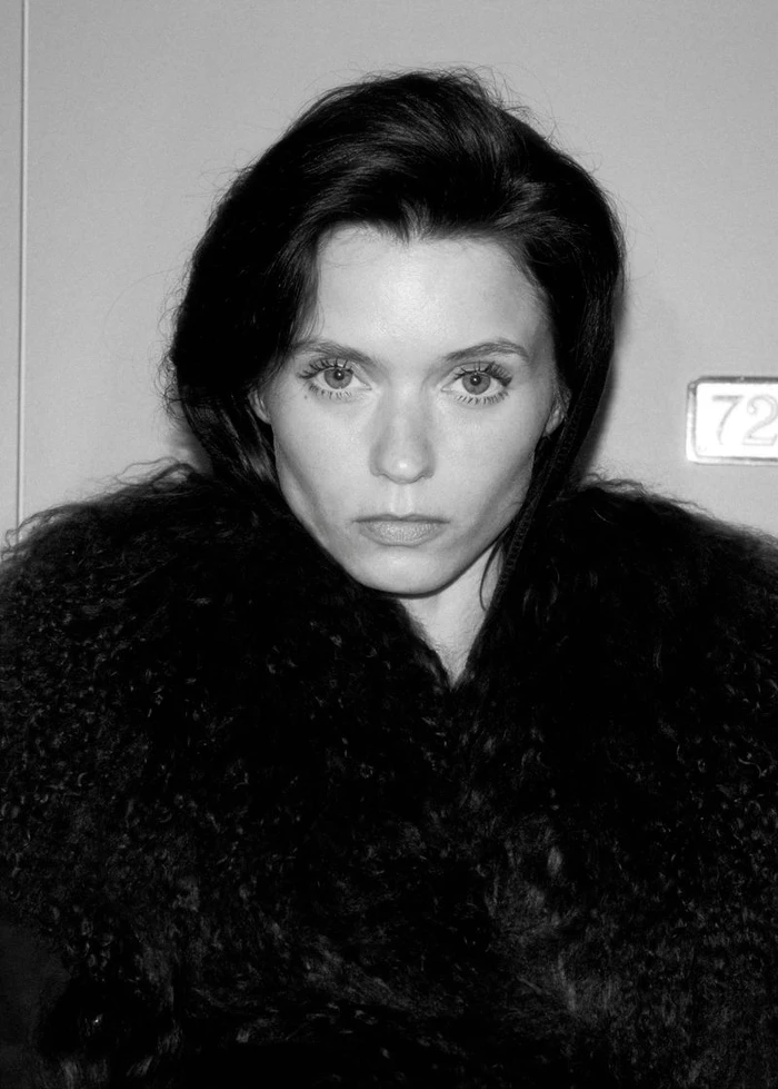 Abbey Lee wearing a dark textured winter coat in a close-up black and white portrait for Mango.