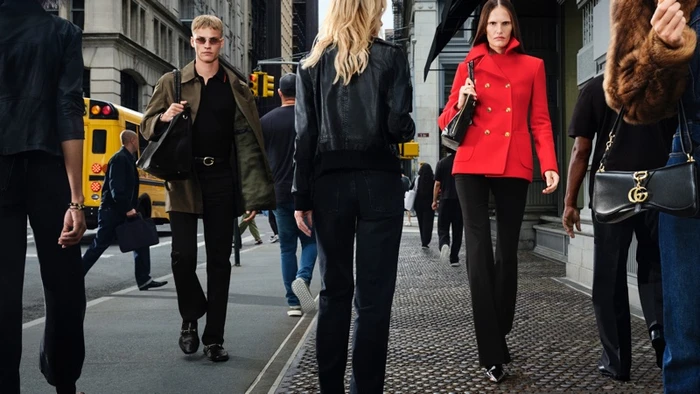 Models walking down a New York street carrying designer handbags during the Gucci Cruise 2027 campaign.
