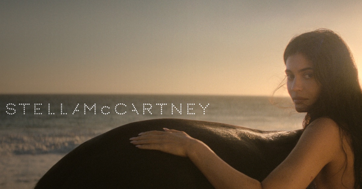 Kylie Jenner posing on a sandy beach at sunset for the Stella McCartney Wild Horses campaign, photographed by Gia Coppola.