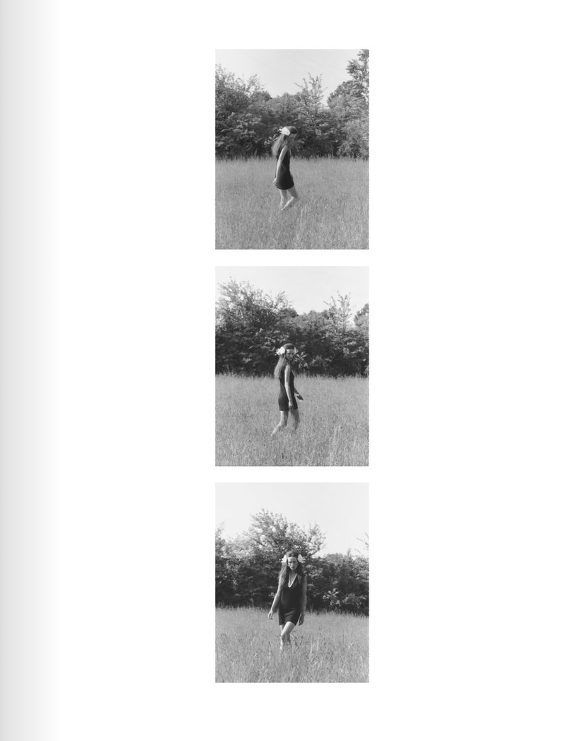 Model Waleska Gorczevski walking through a grassy field in a black dress for Numero Netherlands by Riccardo Dubitante