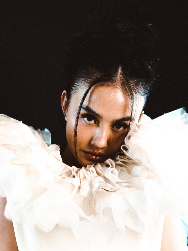 Portrait of Agnez Mo wearing a ruffled white collar garment for Schon Magazine editorial photography by Joelle Grace Taylor