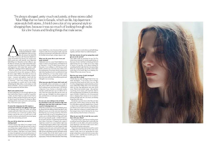 Portrait of a young woman with long brown hair against a light background, featured in More or Less Magazine editorial.
